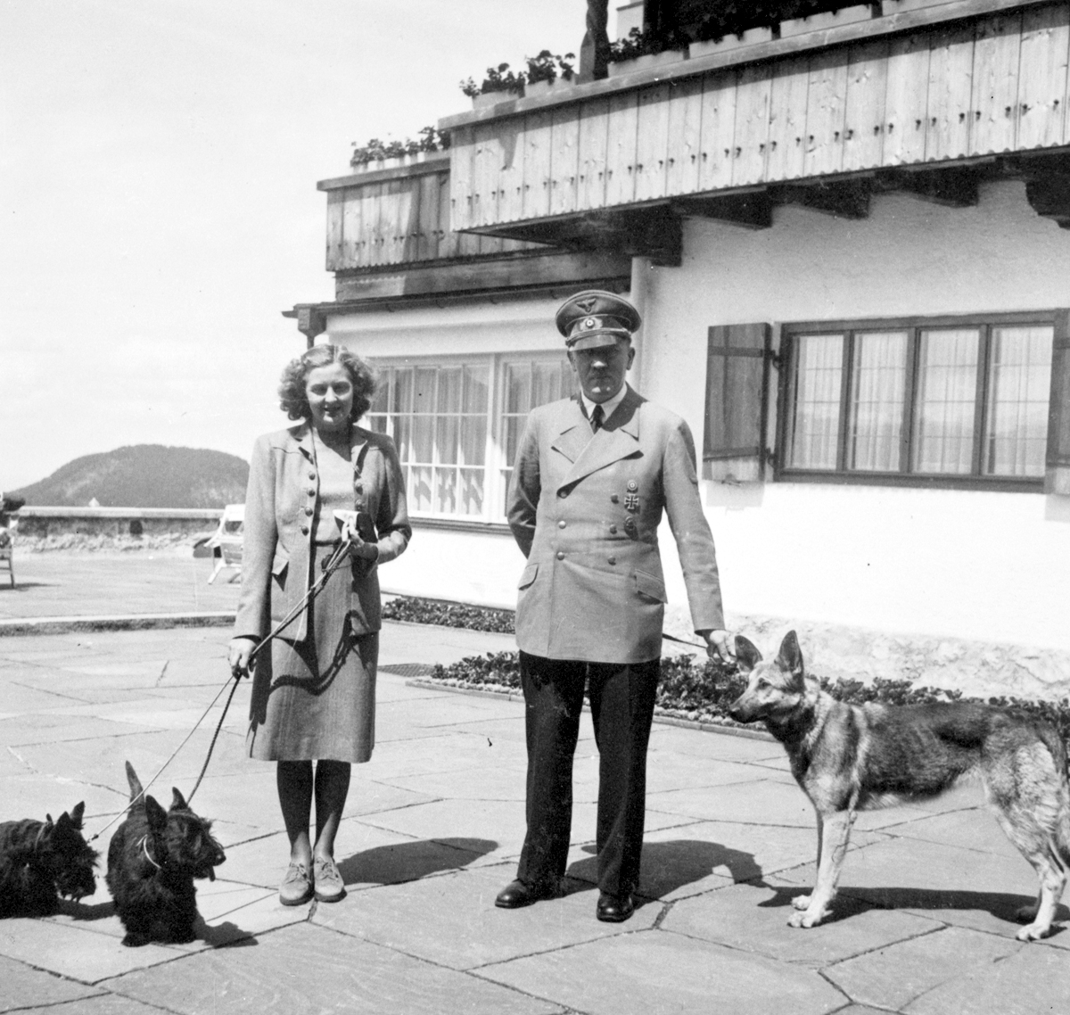 Adolf Hitler and Eva Braun, with their dogs at the Berghof, from Eva Braun's albums